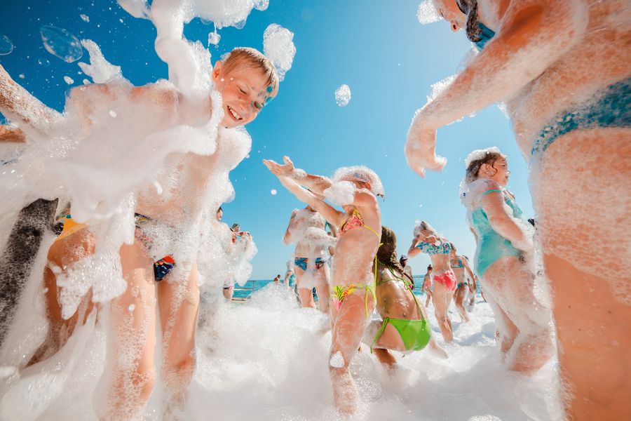 Guest covered head to toe in party foam